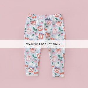May include: Light blue leggings with an all-over pattern of strawberries, cherries, jam jars, and floral elements. The leggings have an elastic waistband and the text "EXAMPLE PRODUCT ONLY" across the center.