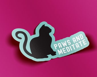 May include: A sticker featuring a black cat silhouette with the words "PAWS AND MEDITATE" in white text on a light blue background. The sticker has a white border and is set against a magenta background.