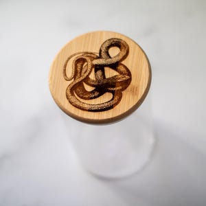 Glass Storage Jar with Snake-Engraved Lid - 6in Tall, Wooden Top Container for Kitchen or Home Decor