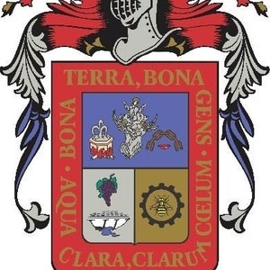 May include: A colourful coat of arms with a red background and gold lettering. The coat of arms features a shield with four sections, each containing a different image. The top section shows a person standing on a hill with a tree behind them. The left section shows a bunch of grapes and a bowl. The right section shows a bee inside a gear. The bottom section shows a bowl with water. The coat of arms is surrounded by a red and gold banner with the words "TERRA, BONA" and "CLARA, CLARUM" written on it. The words "AGUAS CALIENTES" are written below the coat of arms.