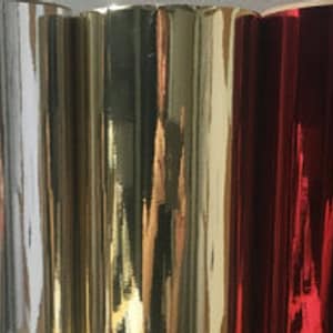 May include: Five rolls of metallic wrapping paper in silver, gold, copper, and red.