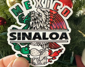 May include: A white sticker with a green, white, and red Mexican eagle design. The words "MEXICO" and "SINALOA" are printed in black on the sticker.
