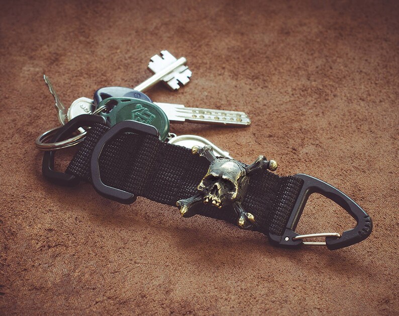 Lanyard keychain \u2013 Designer keychains with a bronze bead-clip.