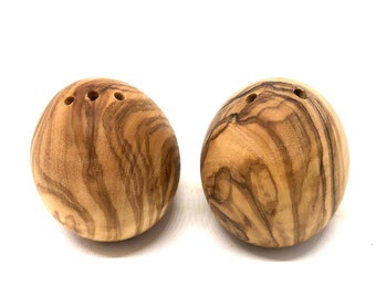 Egg-shaped salt and pepper shakers made from olive wood