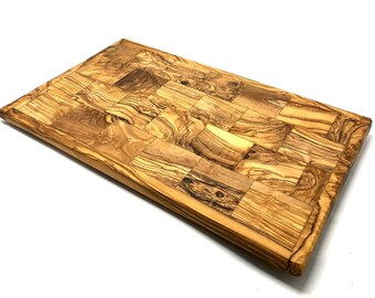 Chopping board made of olive wood, angular (L approx. 42 cm)