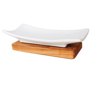 Porcelain soap dish on olive wood plate