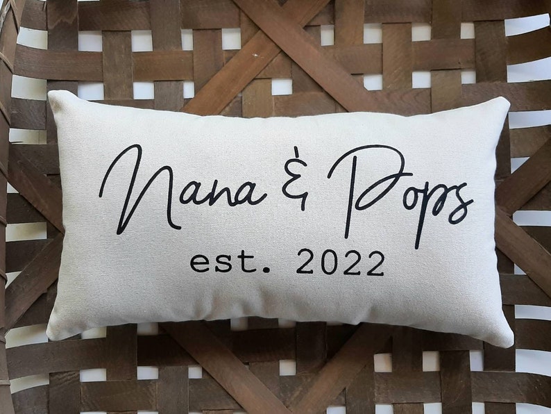 A white pillow with black text