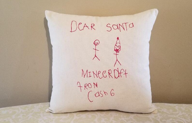 May include: White pillow with red writing that says "Dear Santa Minecraft from Cash 6" with stick figure drawings of a person and Santa Claus.