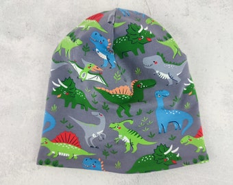 Beanie Dinosaurier, Mütze für Kinder, mit bunten Dinos auf dunkelgrau und apfelgrünem Futter, Größe ca. 48 bis 54 cm Kopfumfang