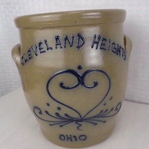 May include: A set of three ceramic mugs with a speckled, matte finish. Each mug features a different color: light blue, cream, and gray. The mugs have a simple, modern design, perfect for coffee or tea.