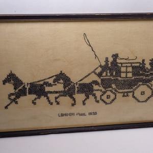 May include: A framed black and white cross-stitch embroidery depicting a horse-drawn carriage with the text "LONDON MAIL 1850".