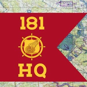 May include: A red flag with the text "181 HQ" in yellow. A yellow emblem with a ship's wheel and wings is centered on the flag. The background is a detailed map.