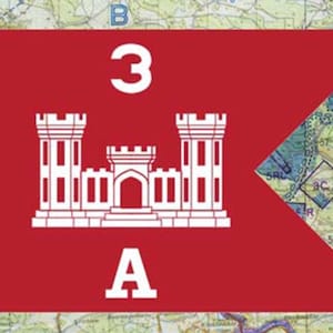 May include: A red flag with a white emblem of a castle and the numbers "3" and the letter "A". The flag is set against a map background.