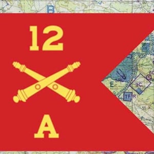 May include: A red flag with the number "12" and the letter "A" in yellow. Two crossed yellow cannons are centered below the number. The flag is set against a map background.