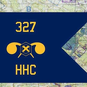 May include: A dark blue flag with the numbers "327" in gold, above a gold emblem and the letters "HHC". The flag is set against a map background.