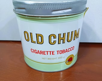 May include: A silver tin with a green label that says "Old Chum Cigarette Tobacco" and "Net Weight 200g".