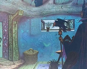 May include: An illustration of a room with a witch-like figure in a black cloak, holding a staff with a raven perched on top. The room has blue walls with floral patterns, a window, and a woven basket.