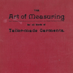 May include: A red book cover with the title "The Art of Measuring Tailor-made Garments." The book was published by The John Williamson Company Limited, located at 42 Gerrard Street, London W.
