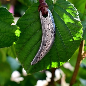 Viking Age Style Damascus Steel Bear&#39;s/Wolf&#39;s Tooth Pendant, comes supplied with jewelry cord.