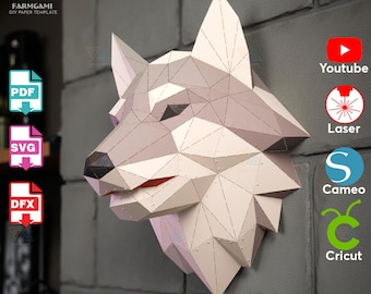 May include: A geometric papercraft wolf head in shades of grey and white, mounted on a grey brick wall. The artwork is a DIY paper template, with PDF, SVG, and DFX file options. The Farmgami logo is in the upper left corner.