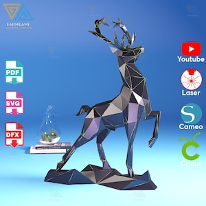 May include: A black and grey papercraft model of a deer standing on a rocky base. The deer is in a polygonal style, with many triangles forming its body. The model is a DIY paper template, and the image includes icons for PDF, SVG, DFX, YouTube, Laser, Cameo, and Cricut.