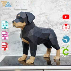 May include: A geometric papercraft Rottweiler dog sculpture. The dog is black with tan markings on its face and legs. The sculpture is made from folded paper and has a polygonal design. The image also includes icons for PDF, SVG, and DFX file formats.