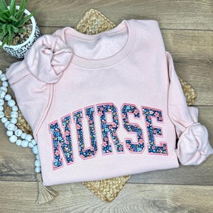Embroidered Nurse Sweatshirt for RN Nurses Appreciation Gift Under 50 Dollars Graduation Shirt for New LPN Crewneck Gift