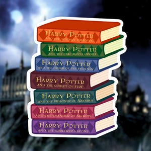May include: A stack of seven colorful books with the Harry Potter series titles and author's name. The books are stacked from largest to smallest, with the top book being "Harry Potter and the Deathly Hallows".