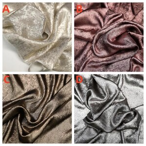Pode incluir: Quatro amostras de tecido em diferentes cores e texturas. As amostras est&atilde;o dispostas em uma grade. A amostra superior esquerda &eacute; de cor ouro claro com um brilho sutil. A amostra superior direita &eacute; de cor ouro rosa com uma textura suave e sedosa. A amostra inferior esquerda &eacute; de cor marrom escuro com um brilho sutil. A amostra inferior direita &eacute; de cor prata com uma textura suave e sedosa.