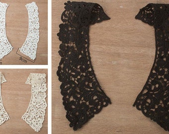 May include: Two pairs of white lace collars, each measuring 9 inches wide and 31 inches long. The collars are made of delicate lace with a floral pattern.