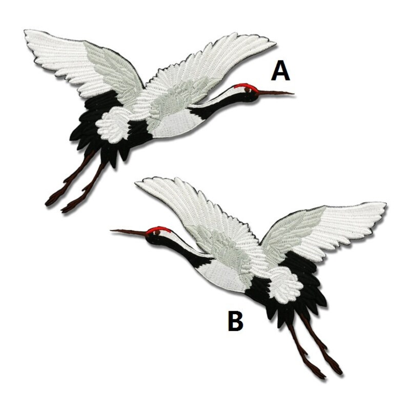 May include: Two white and black embroidered iron-on patches of Japanese cranes in flight. The patches are labeled A and B.