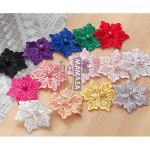 May include: A collection of embroidered flower appliques in various colors, including black, purple, blue, green, red, pink, peach, white, yellow, and silver. Each flower features a central pearl embellishment. The word "MAMASA" is printed on the image.