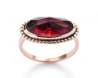 Oval Rose Gold ring with Faceted Garnet