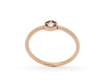 Dainty Rose Gold Ring with a Central Diamond