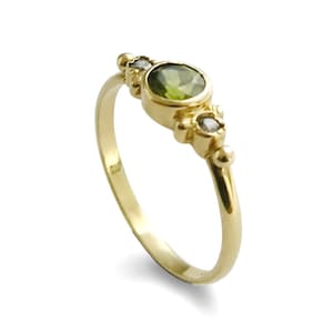 Green Peridot and Zircons gold ring