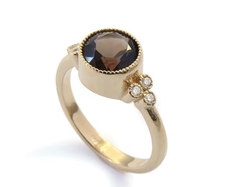 Gold ring with Oval Smokey Quartz and Zircons