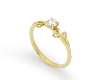 Dainty Gold Swivel Ring with Mixed-Size Diamonds