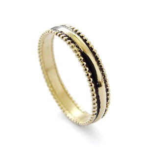 Gold wedding ring with dots