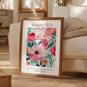 May include: A framed print with a floral design and the text "Romans 12:12 Be joyful in hope, patient in affliction, faithful in prayer."