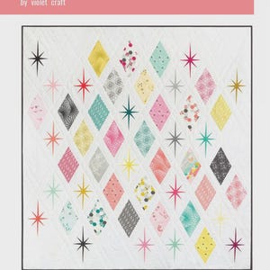 May include: The Atomic Starburst quilt by Violet Craft. A white quilt with a diamond pattern in various colors, including pink, yellow, teal, and gray. Starburst designs are scattered throughout the quilt. The text "the Atomic Starburst quilt" is at the top.