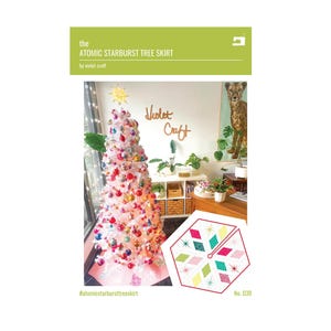 May include: A sewing pattern titled The Atomic Starburst Tree Skirt by Violet Craft. The cover features a white Christmas tree decorated with colorful ornaments and a graphic illustration of a hexagonal tree skirt with starburst patterns.