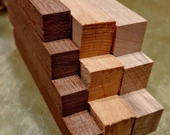 May include: Stacked wooden blocks in two different wood types. The top block is light brown wood, the second block is dark brown wood, and the third block is light brown wood. The pattern continues with alternating wood types.