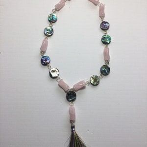 Rose quartz twisted tube necklace with abalone coins and tassel