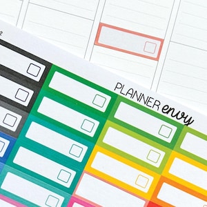 Puede incluir: Pegatinas de planificador coloridas con el texto "PLANNER envy" y el texto "Shown in our Planner Envy Vertical layout planner." Las pegatinas están diseñadas para columnas o cajas de 3,8 cm.