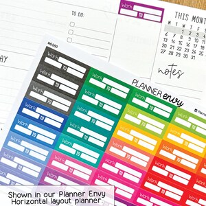 May include: A sheet of colorful planner stickers with the words "Work" and "TO" printed on them. The stickers are in various colors, including black, blue, green, yellow, orange, red, and pink. The stickers are designed for use in a planner and are labeled "Planner Envy".