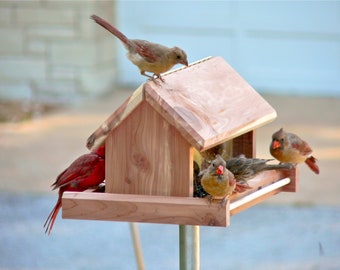 Cardinal Bird Feeder is hand crafted from finely milled aromatic red cedar and hangs from a rust resistant chain, it can be pole mounted