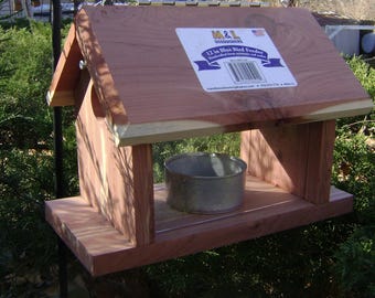 Mealworm Bluebird Feeder is hand crafted from aromatic red cedar and has two openings for the birds to enter the feeder to eat meal worms