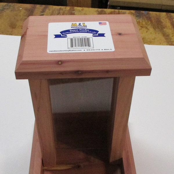 Hanging Bird Feeder holds 3 pounds of seed and is hand crafted from finely milled aromatic red cedar for long lasting durability.