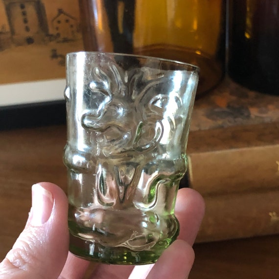 Modern troll glass small glass / shot glass embossed troll figurine with green tint to glass