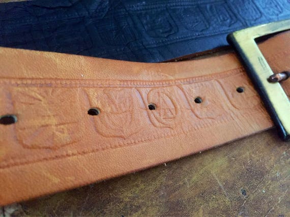 Tooled leather belt brass buckle with patina leather laced detail jacob great 70s vibe folk